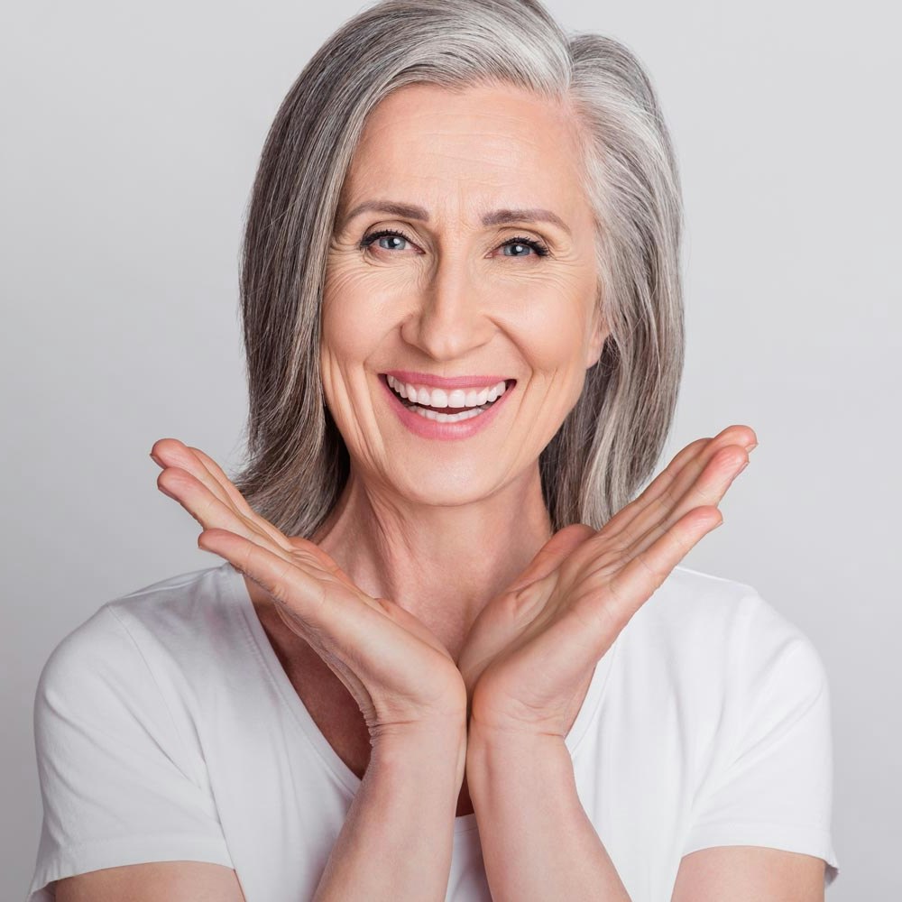 smiling woman with gray hair
