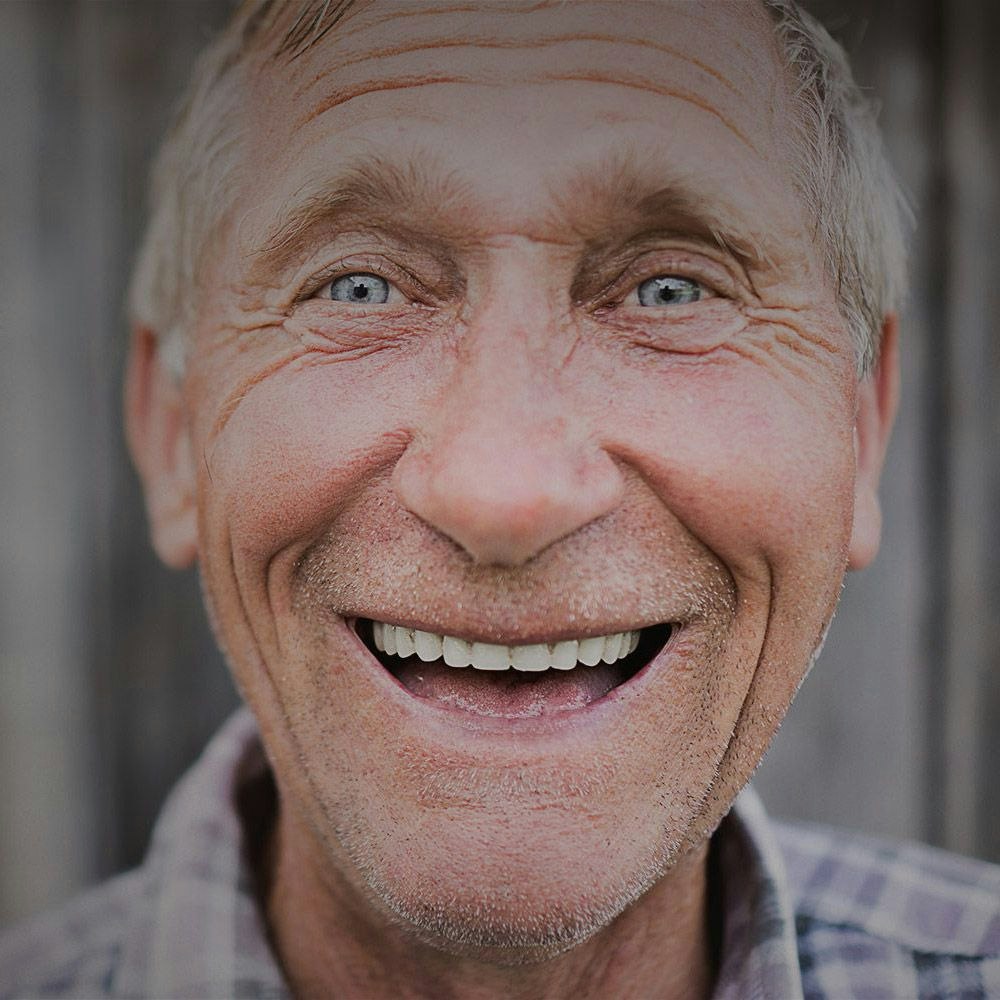 smiling man with dentures