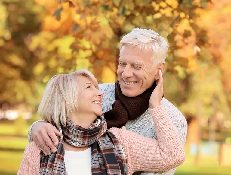 Senior person smiling with restored teeth